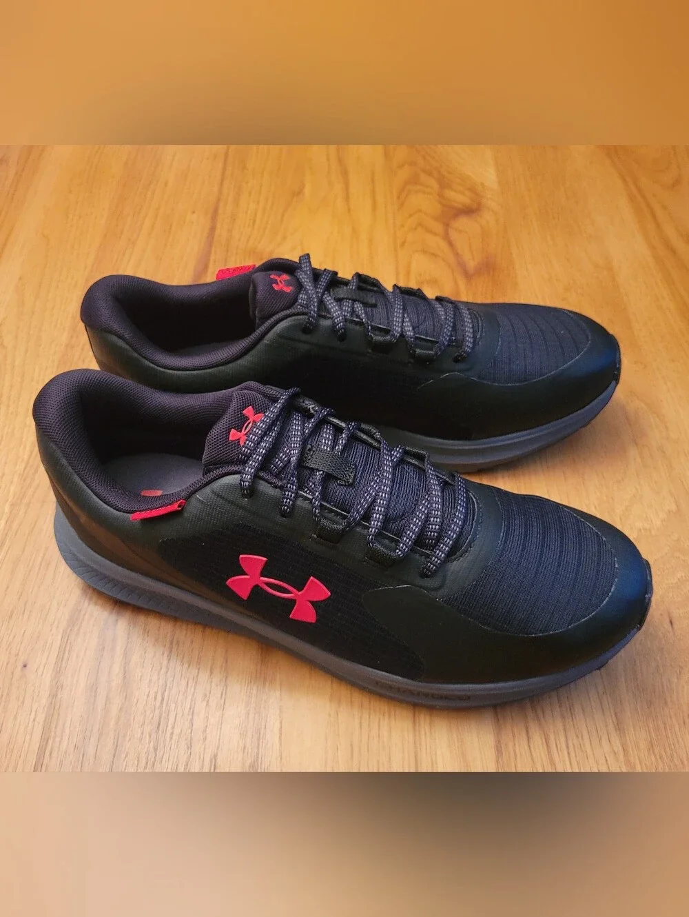 Under Armour Men's Black Running Sneakers with Red Logo Accents